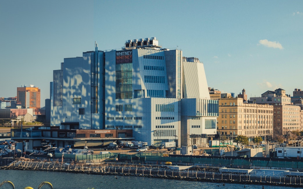 Whitney Museum of American Art exterior in New York City with surrounding buildings.