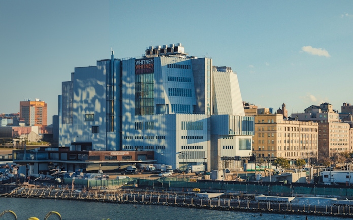 Whitney Museum of American Art exterior in New York City with surrounding buildings.