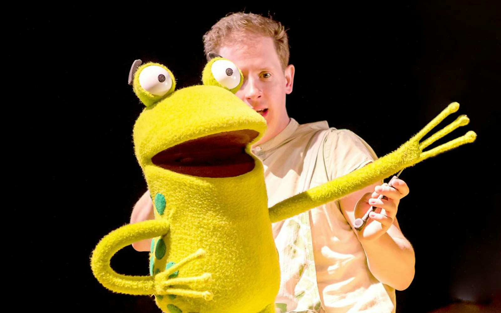Puppeteer with frog puppet from "Oi Frog & Friends!" show.