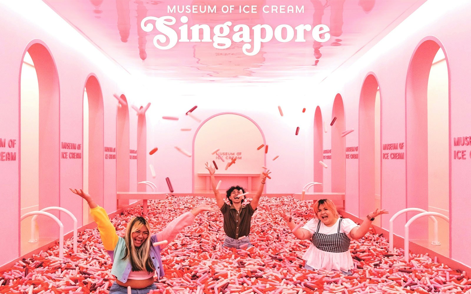 Visitors exploring colorful exhibits at Museum of Ice Cream Singapore.