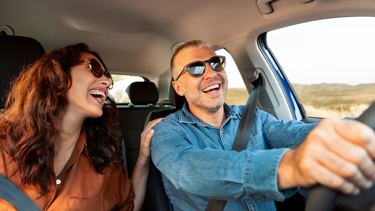 Couple enjoying a road trip by car from to Mallorca
