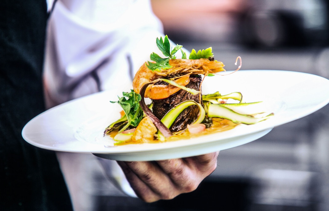 Plate of gourmet seafood and vegetables served at Alfond Inn's New Year's Eve Gala in Orlando.