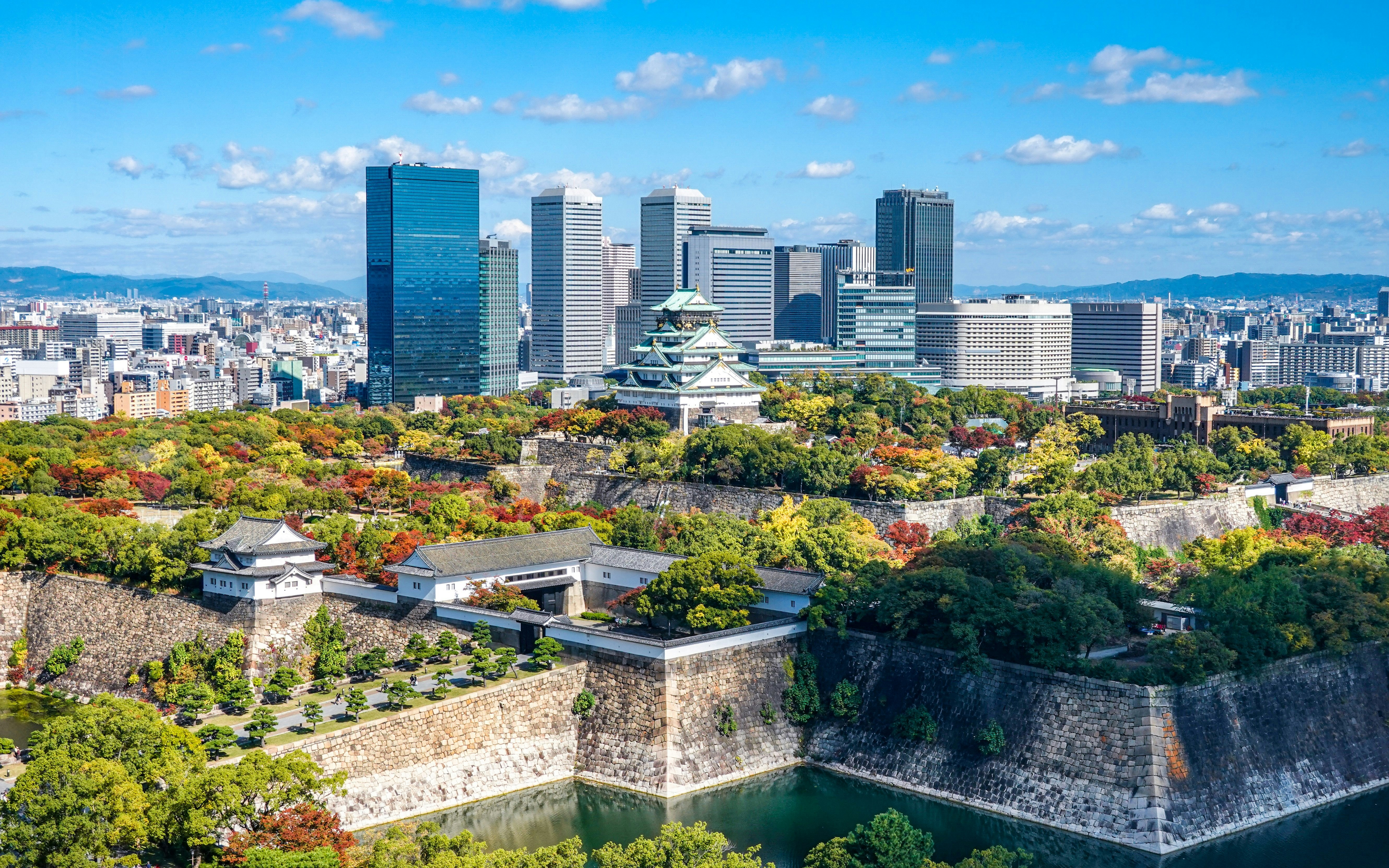 Osaka Castle Tower with Osaka Business Park skyscrapers in the background, Osaka City.