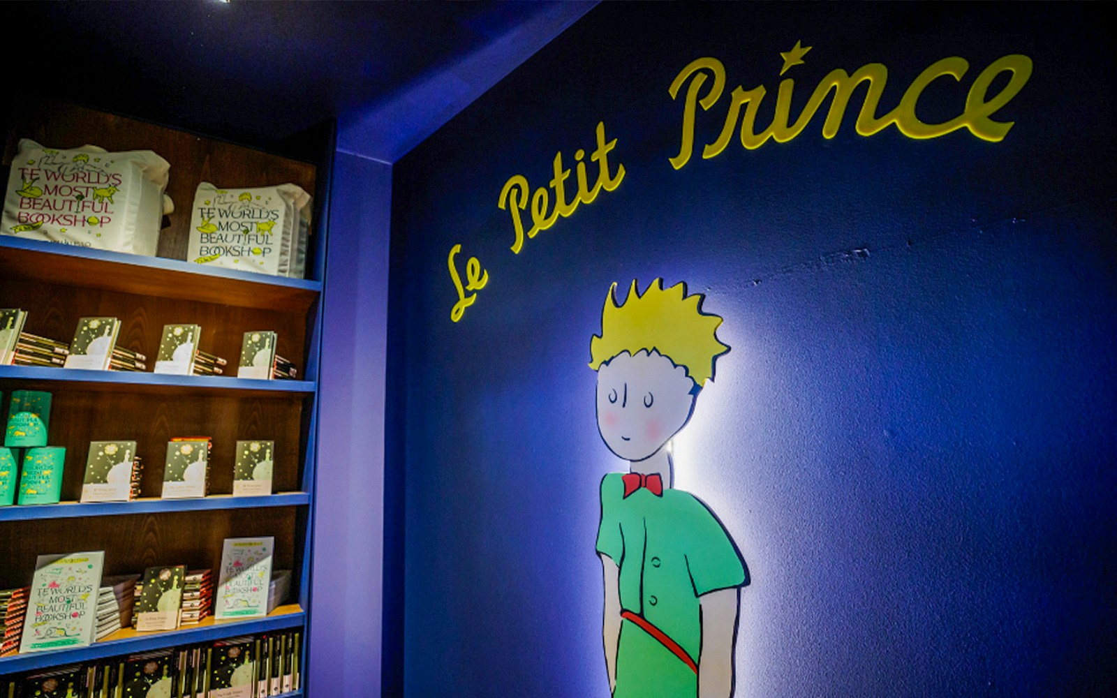 Little Prince Room in Lello Library, Porto, featuring ornate bookshelves and a central reading area.