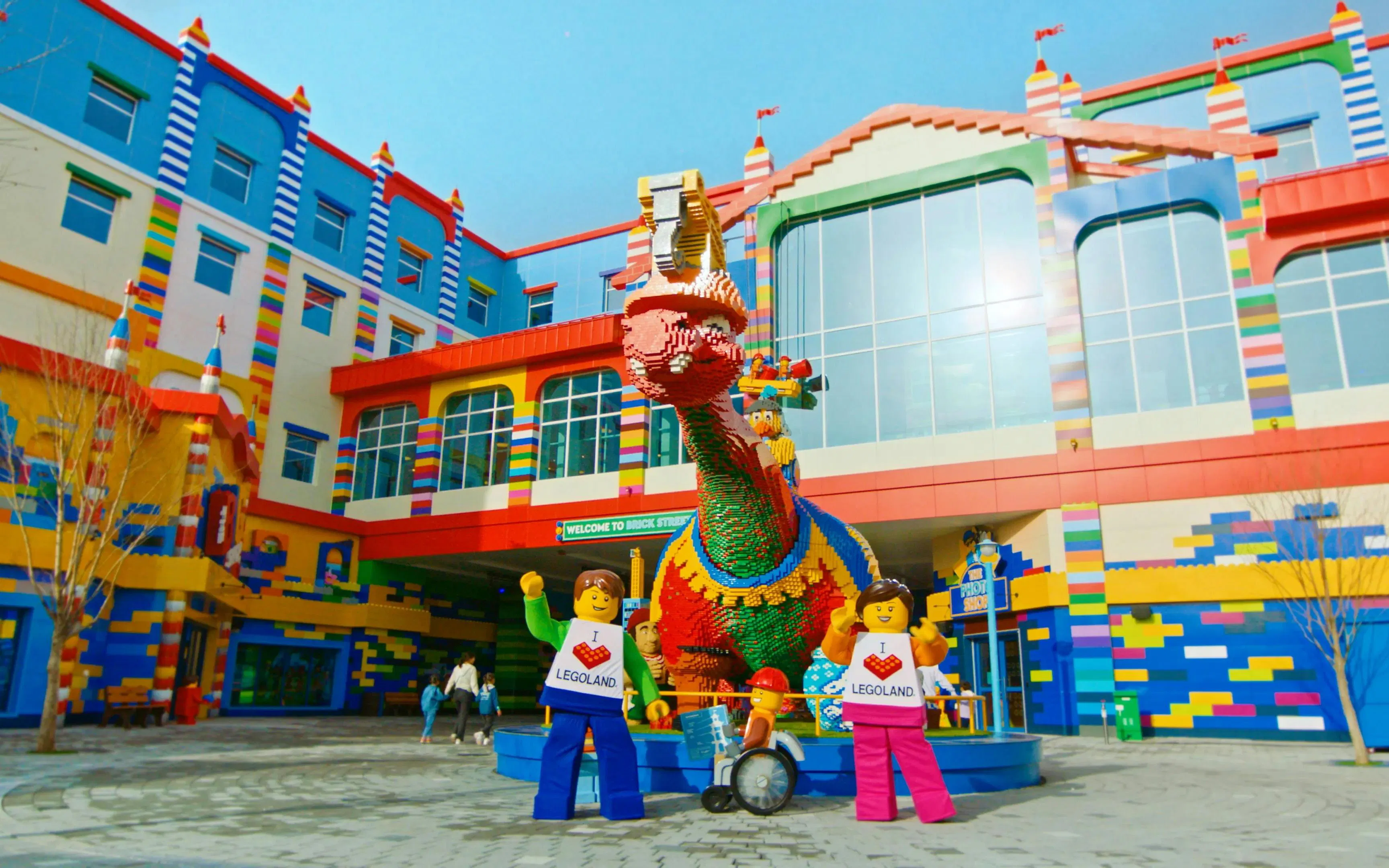 Entrance of LEGOLAND Korea Resort with colorful LEGO sculptures and characters.