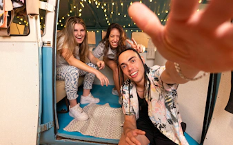 Group enjoying interactive exhibit at The Upside Down Museum, Berlin.