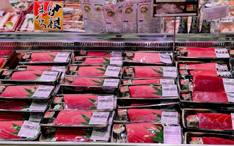 Packaged tuna displayed for sale in a Japanese supermarket.