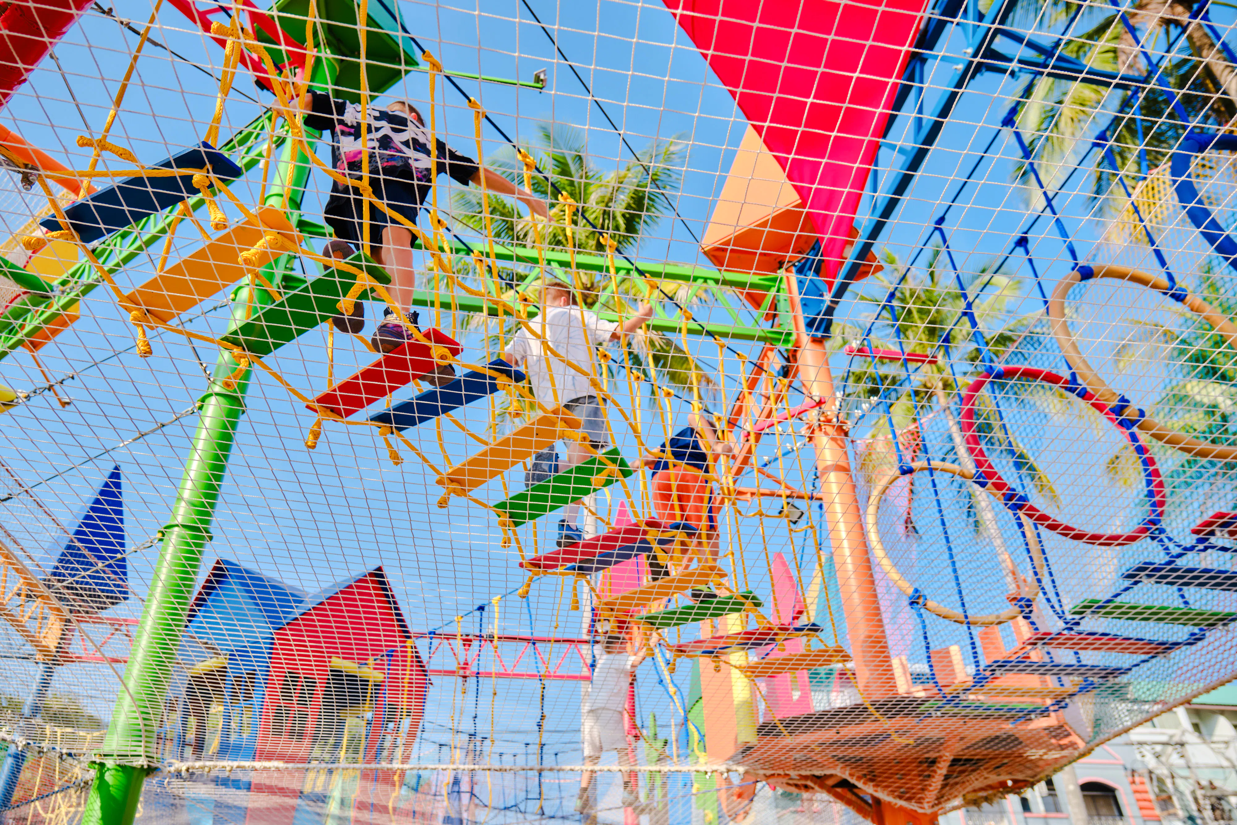 Children playing on a colorful adventure playground in Phuket during a 3.5-hour birthday party.