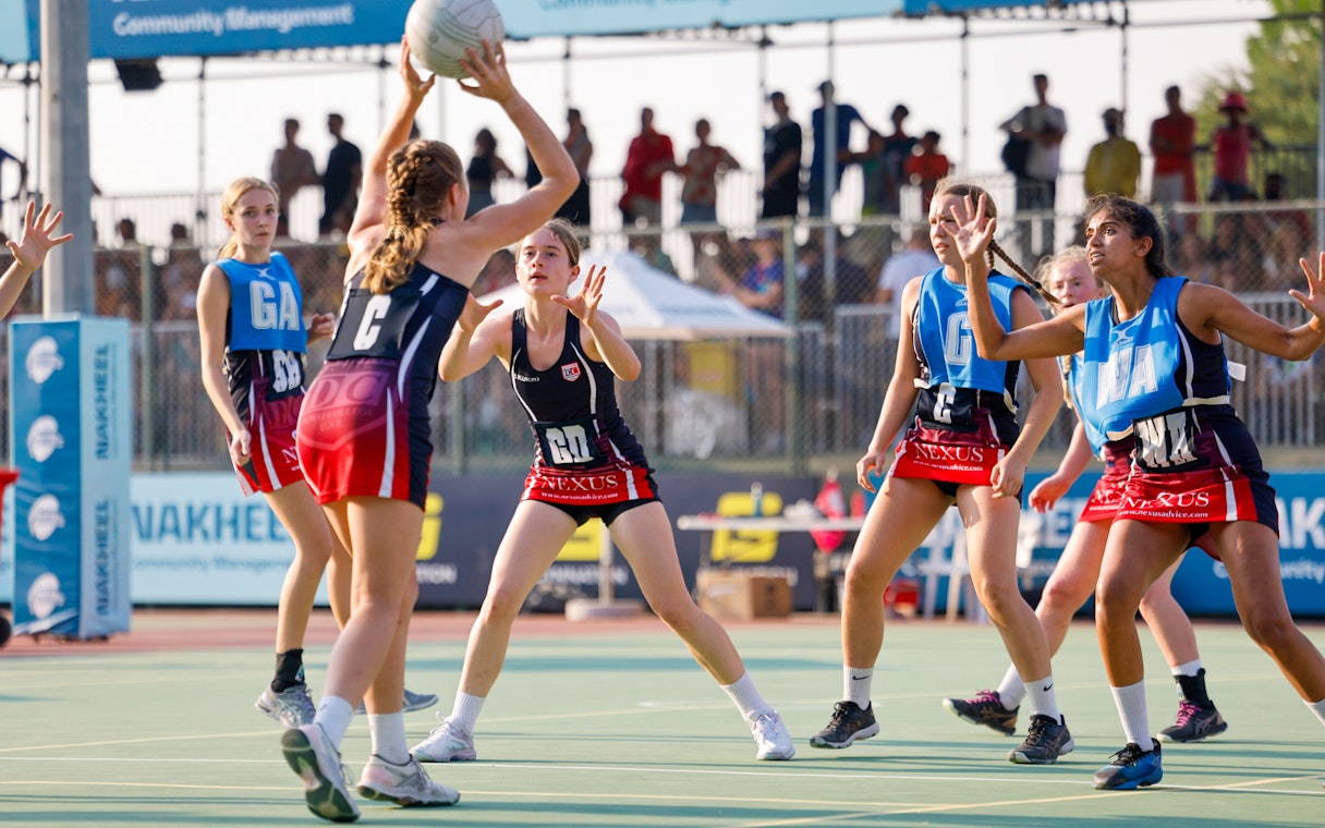 Women playing netball at Emirates Dubai 7s event.
