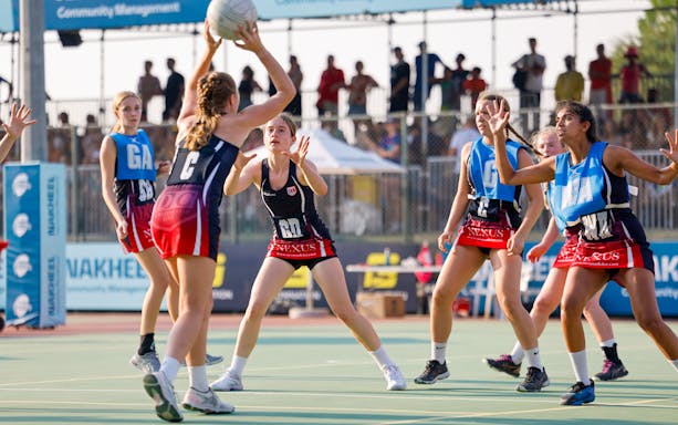 Women playing netball at Emirates Dubai 7s event.