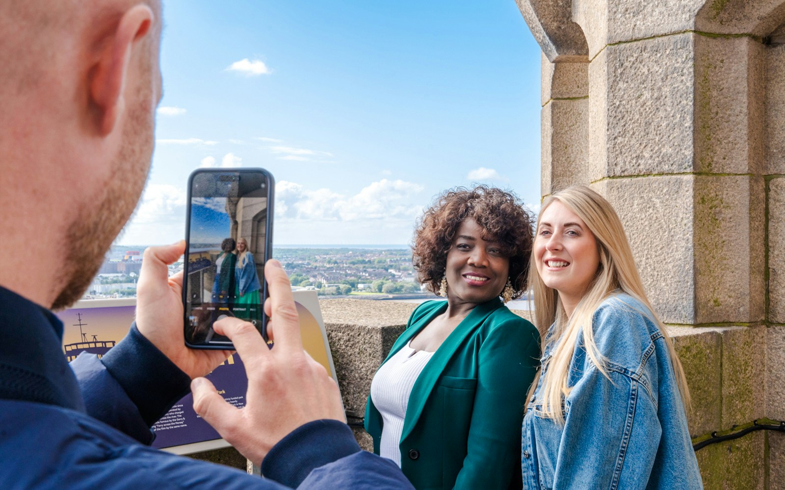 Guests posing for a photo at the Royal Liver Building in Liverpool.