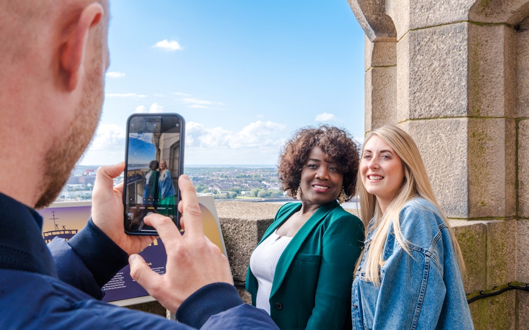 Guests posing for a photo at the Royal Liver Building in Liverpool.