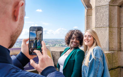 Guests posing for a photo at the Royal Liver Building in Liverpool.