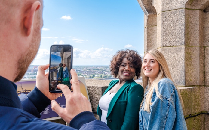 Guests posing for a photo at the Royal Liver Building in Liverpool.