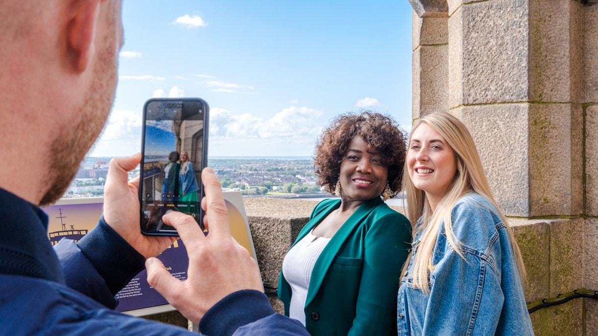 Guests posing for a photo at the Royal Liver Building in Liverpool.