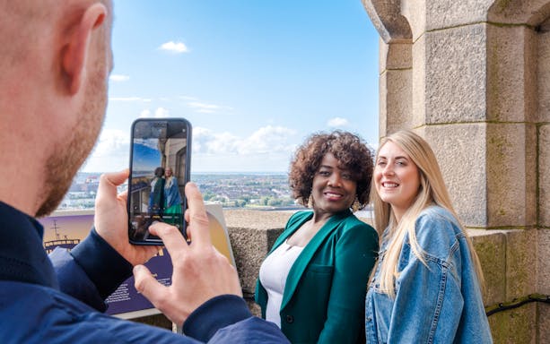 Guests posing for a photo at the Royal Liver Building in Liverpool.