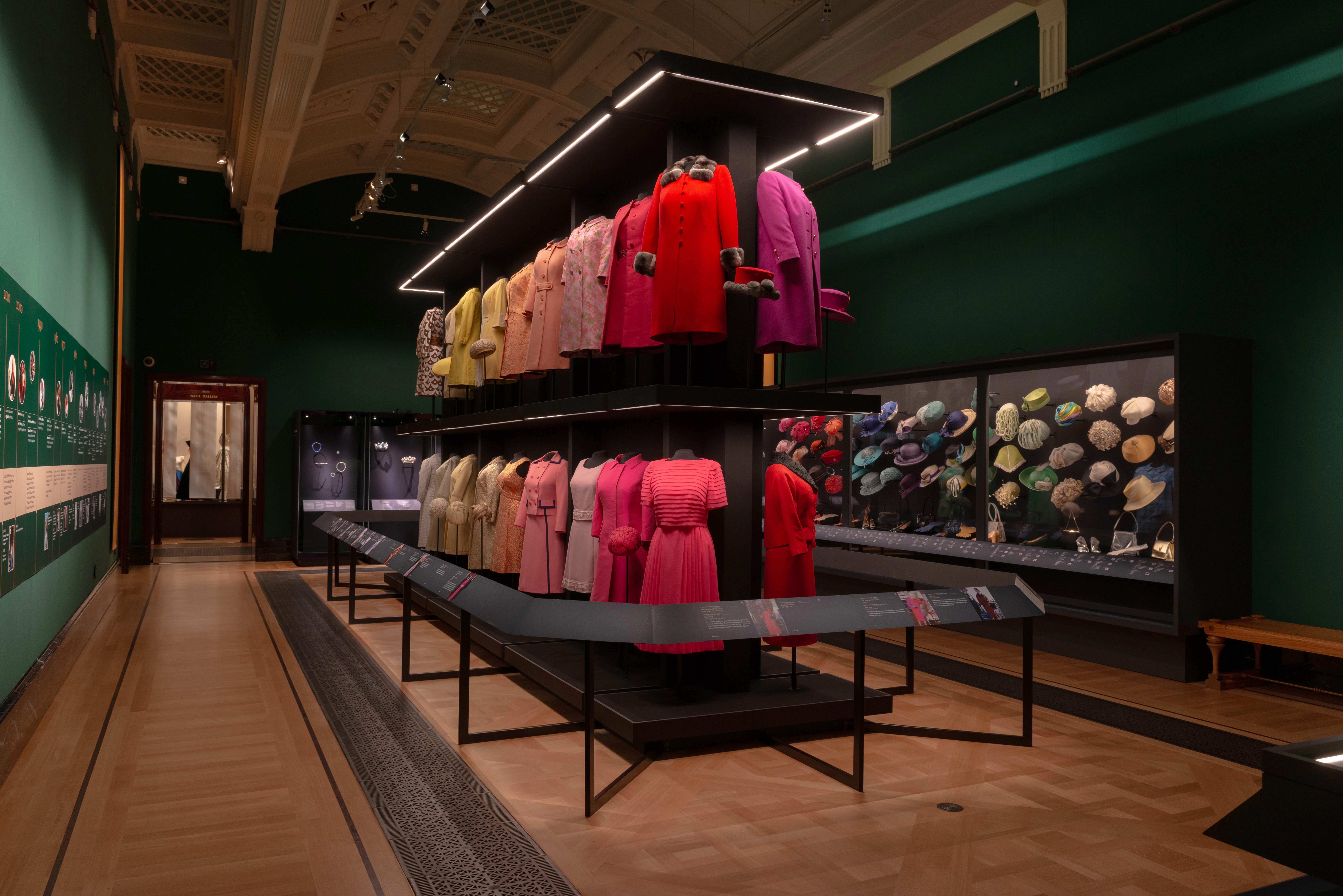 Dresses and hats displayed at the 'Her Life in Style' exhibit, The King's Gallery, Buckingham Palace.