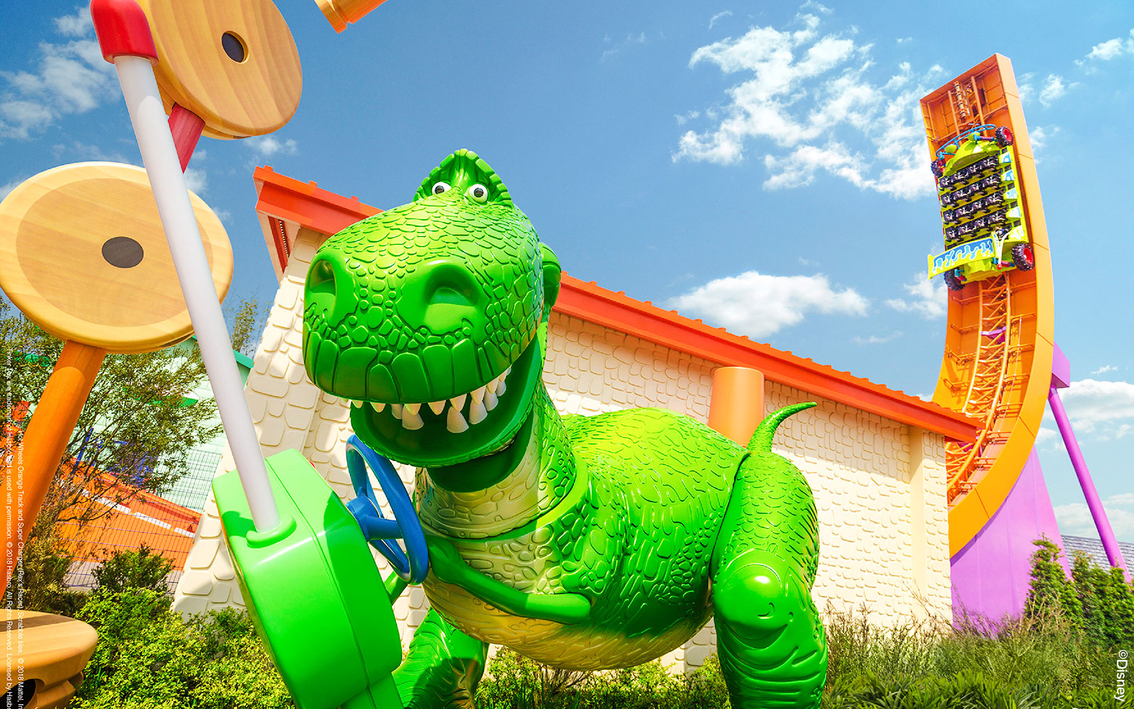 Rex's Racer ride in Toy Story Land, Shanghai Disneyland, featuring a large green dinosaur.