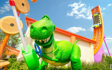 Rex's Racer ride in Toy Story Land, Shanghai Disneyland, featuring a large green dinosaur.