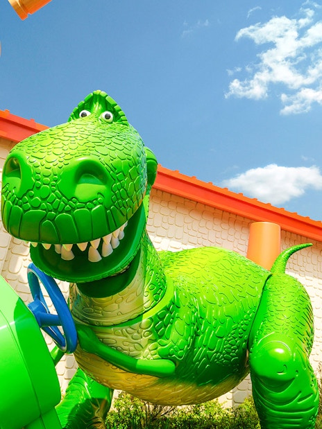 Rex's Racer ride in Toy Story Land, Shanghai Disneyland, featuring a large green dinosaur.