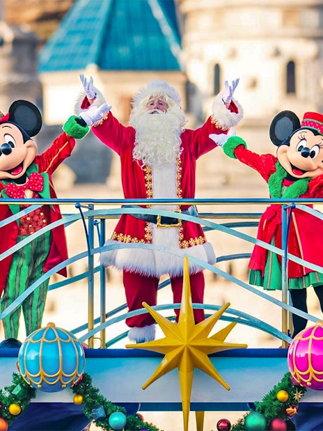 Mickey and Minnie Mouse with Santa at Tokyo DisneySea holiday event.