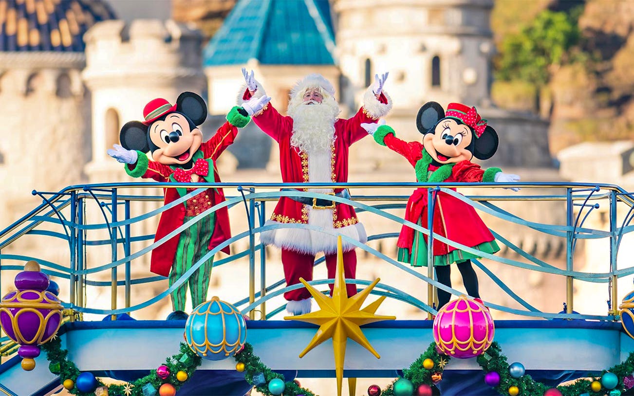 Mickey and Minnie Mouse with Santa at Tokyo DisneySea holiday event.