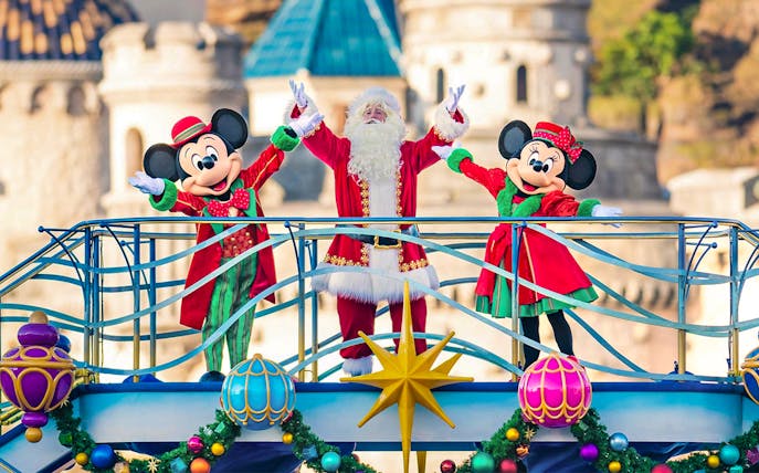 Mickey and Minnie Mouse with Santa at Tokyo DisneySea holiday event.
