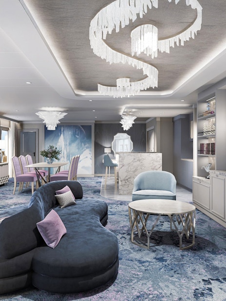 Concierge Royal Suite with oceanview verandah on Disney Adventure Cruise, featuring elegant seating and decor.