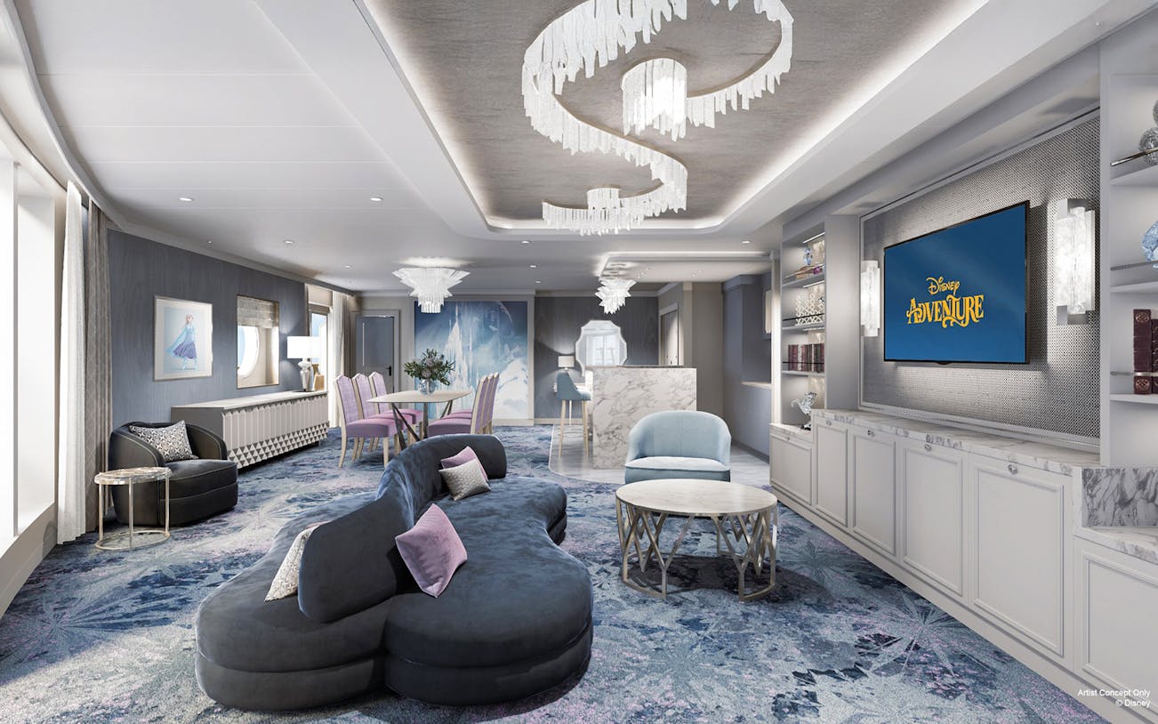 Concierge Royal Suite with oceanview verandah on Disney Adventure Cruise, featuring elegant seating and decor.