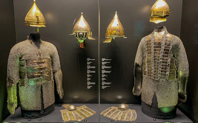 Armory display of chainmail and helmets at Topkapi Palace's Imperial Treasury in Istanbul, Turkey.