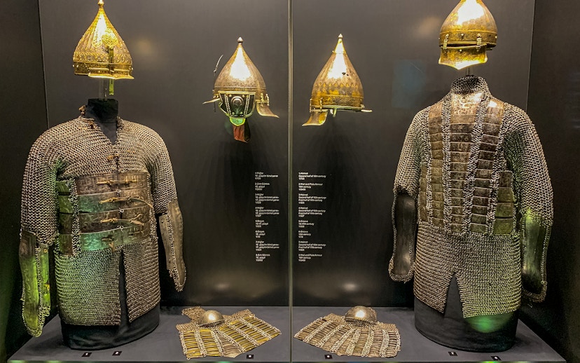 Armory display of chainmail and helmets at Topkapi Palace's Imperial Treasury in Istanbul, Turkey.