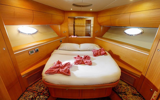 Luxurious cabin interior on a private yacht rental in Dubai.