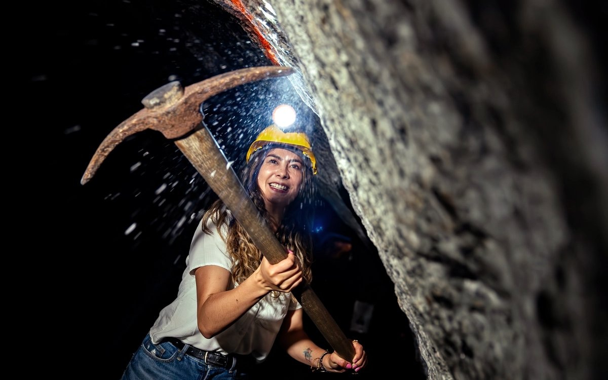 Miner's route participant with pickaxe at Salt Cathedral of Zipaquirá.