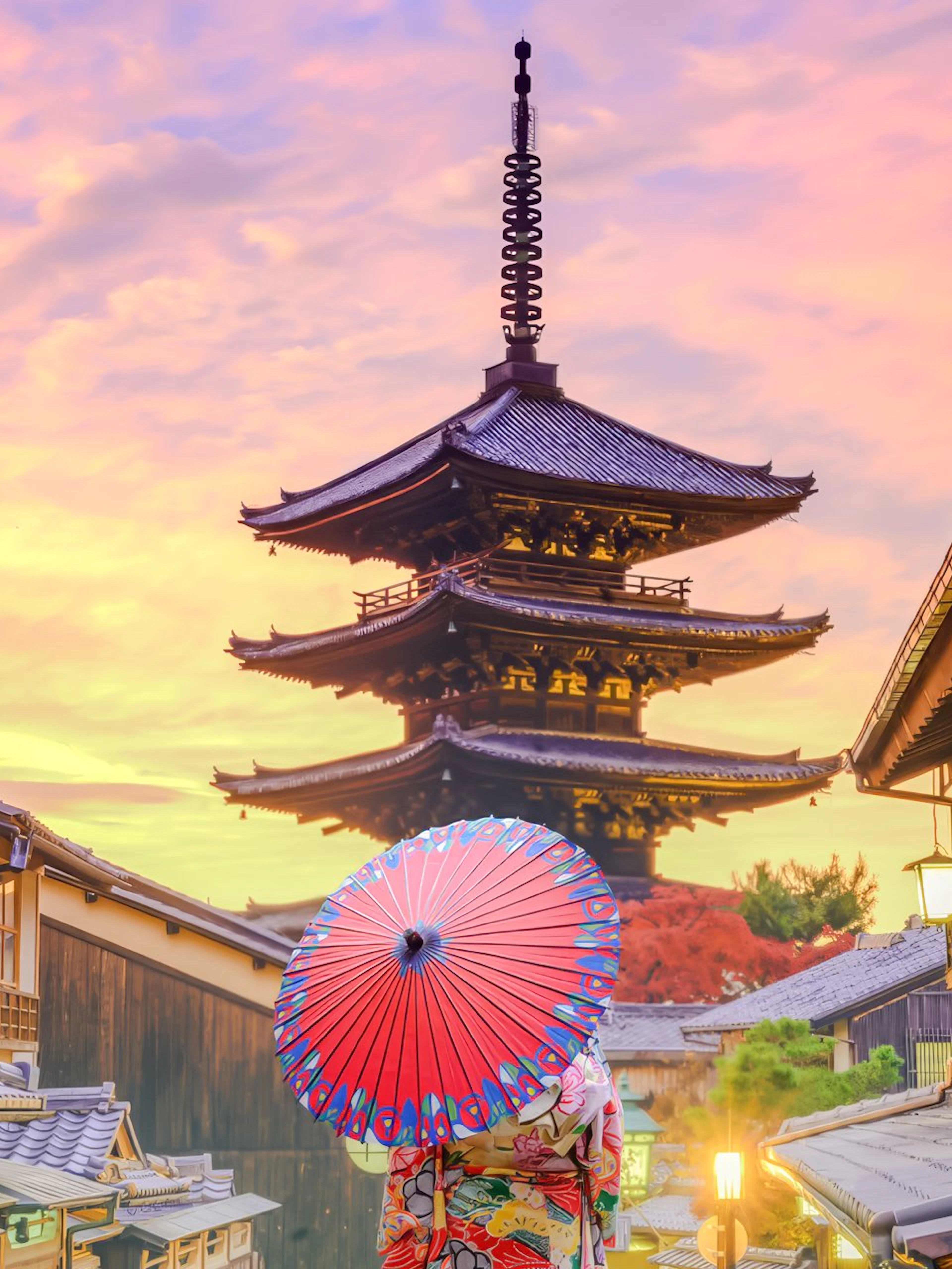 Yasaka Pagoda in Higashiyama, Kyoto, with a person holding a red umbrella.
