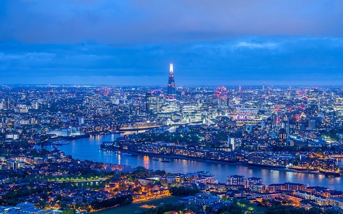 London skyline at night with The Shard and River Thames.