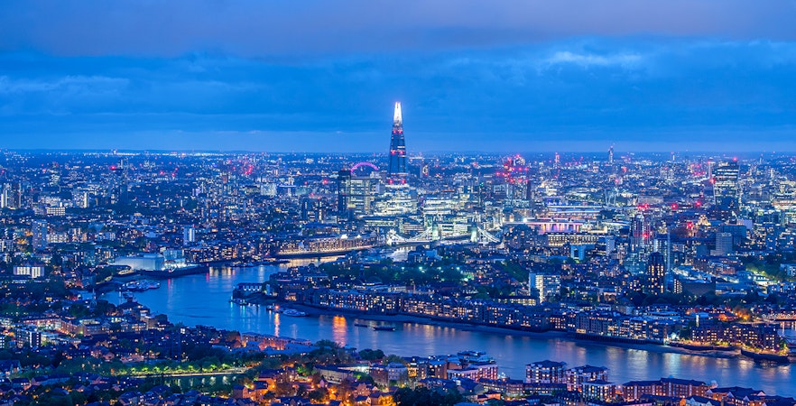 London skyline at night with The Shard and River Thames.