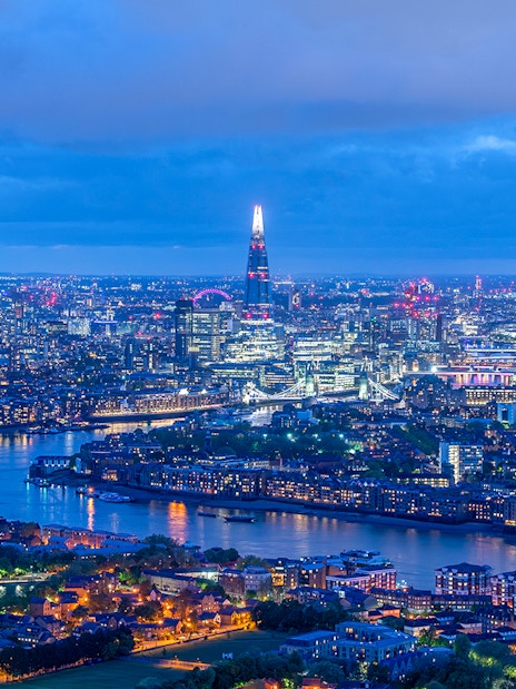 London skyline at night with The Shard and River Thames.
