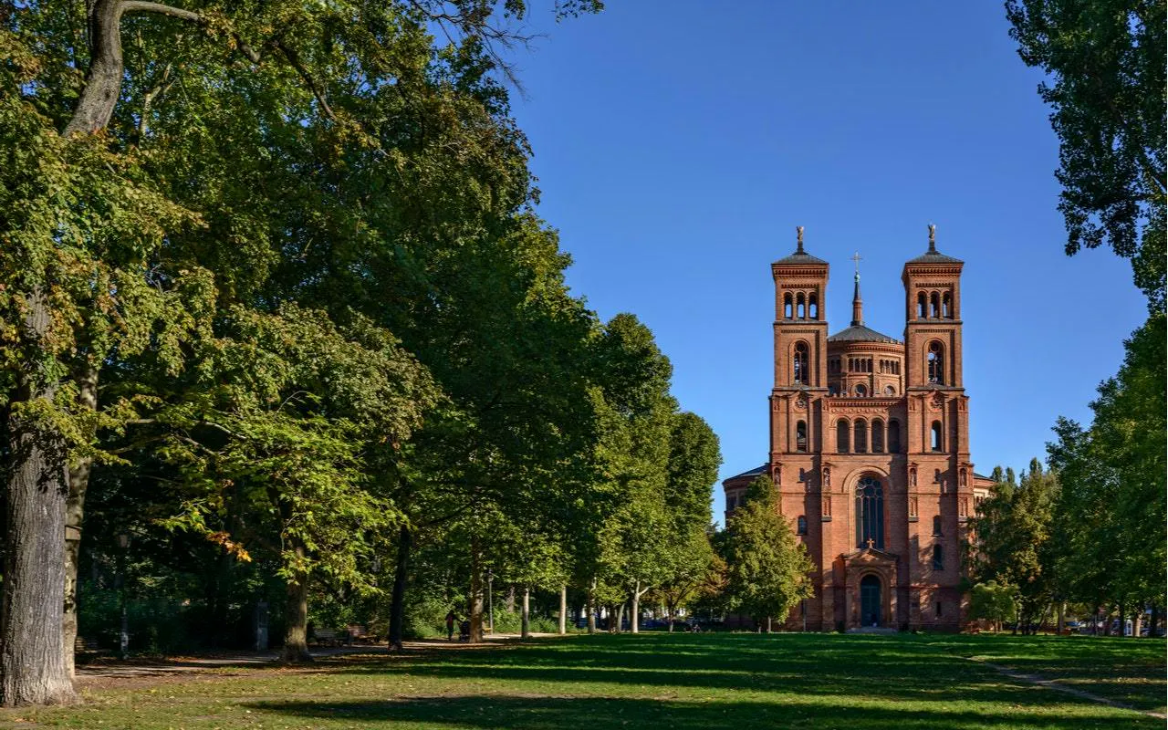 Red brick church in a park setting, Kreuzberg, Berlin.