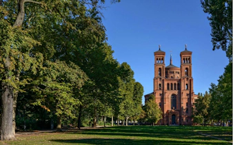 Red brick church in a park setting, Kreuzberg, Berlin.