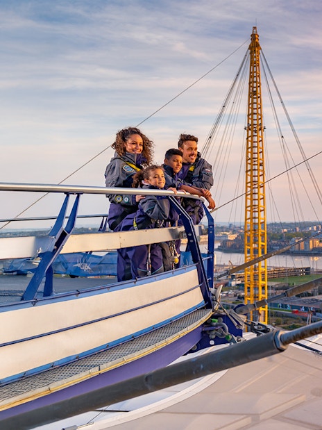 Guests enjoying the view from the O2 roof at sunset in London.