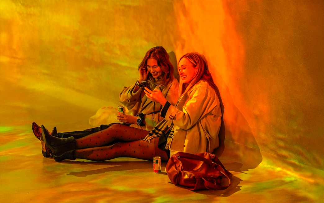 Visitors enjoying interactive exhibit at Frameless Lates event.