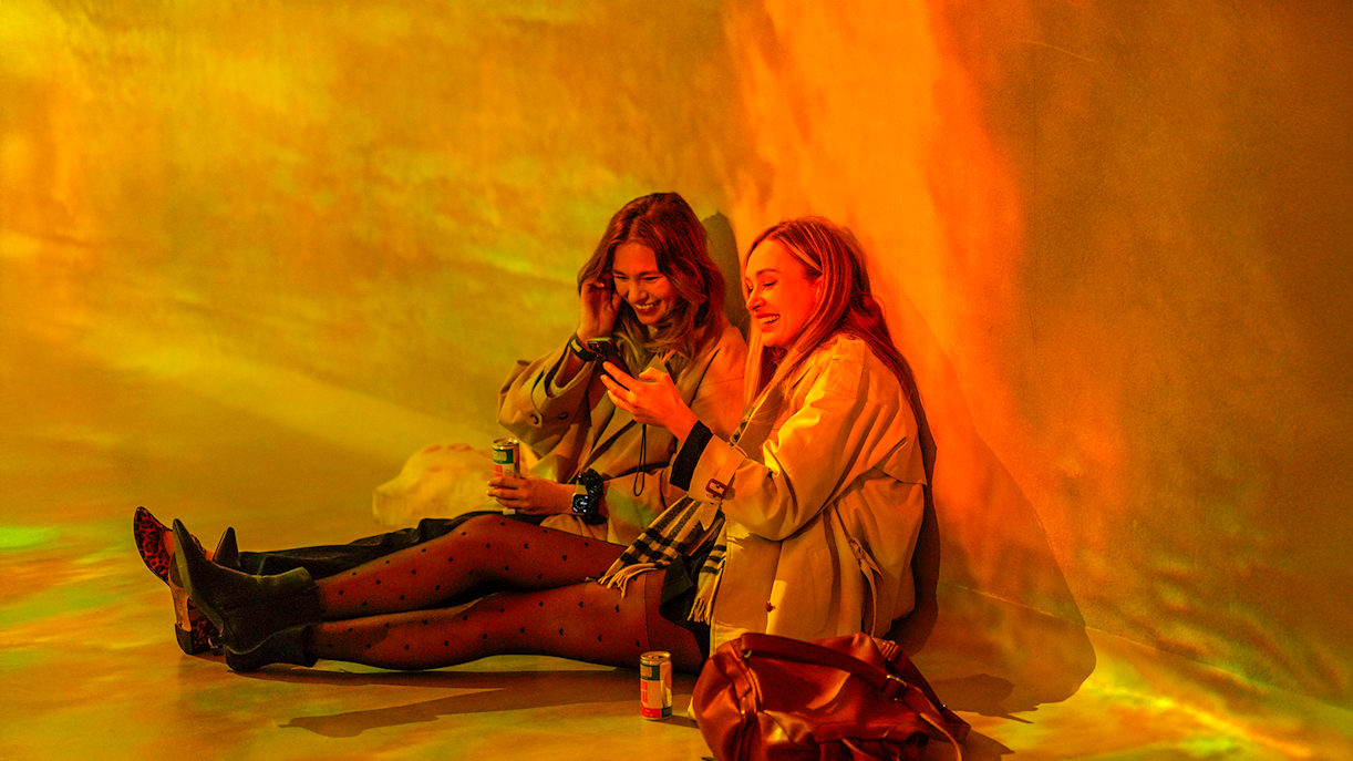 Visitors exploring immersive art exhibit at Frameless Lates in London.