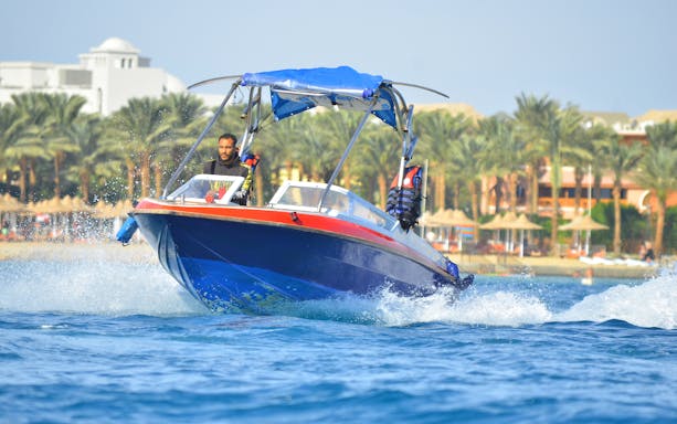 Private speedboat on water near Dolphin House, suitable for up to six people.