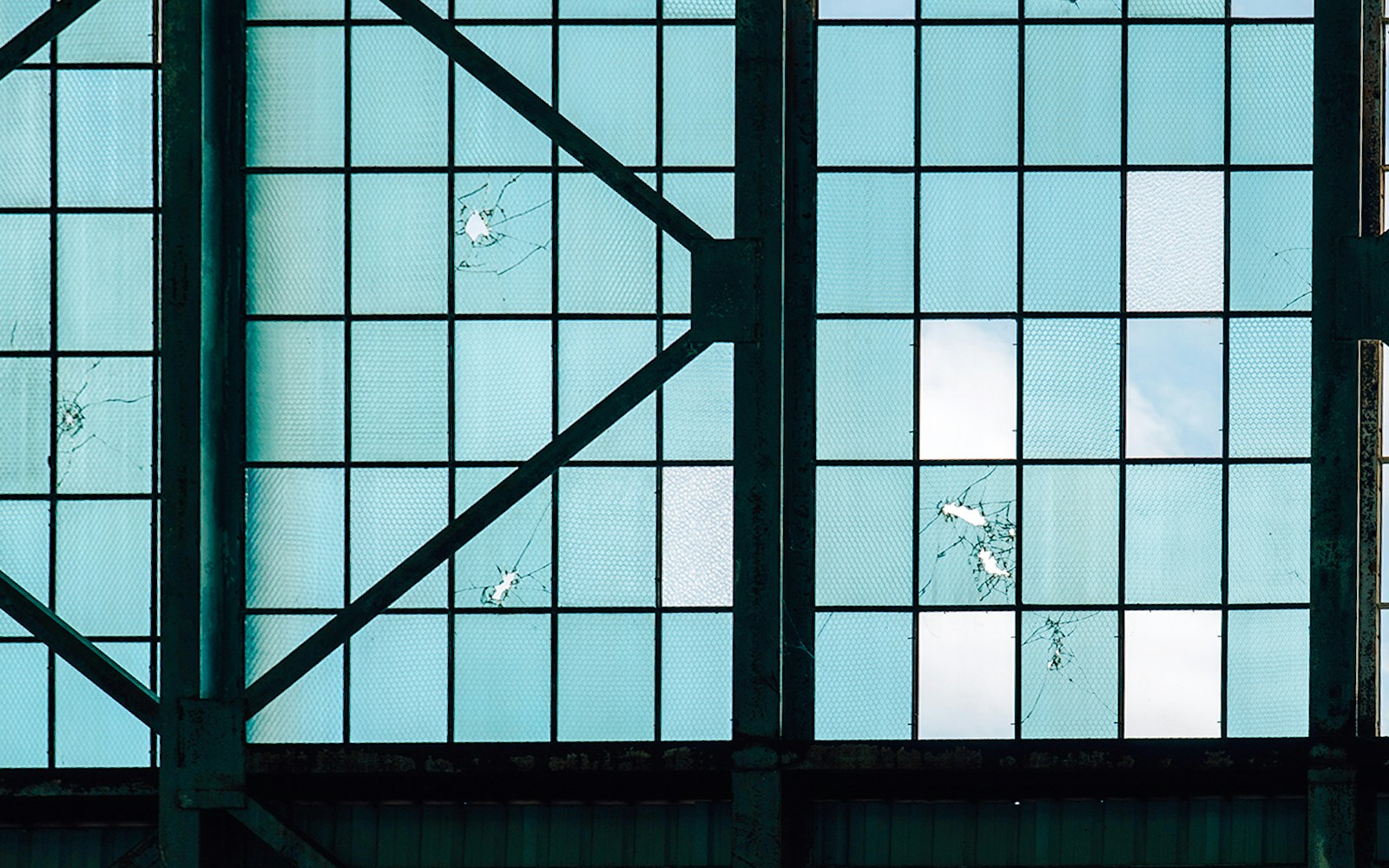 Bullet holes in Hangar 79 window from WWII Japanese air raid, Pearl Harbor.