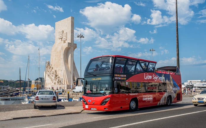 Lisbon Cityrama HOHO tour bus near Monument of Discoveries.