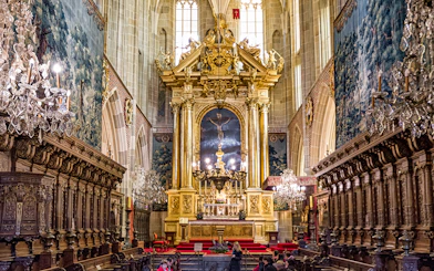 Wawel Cathedral interior with ornate altar and chandeliers, Krakow guided tour.