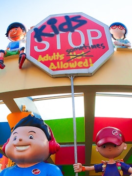 KidsStop Singapore entrance with colorful cartoon figures and playful signage.