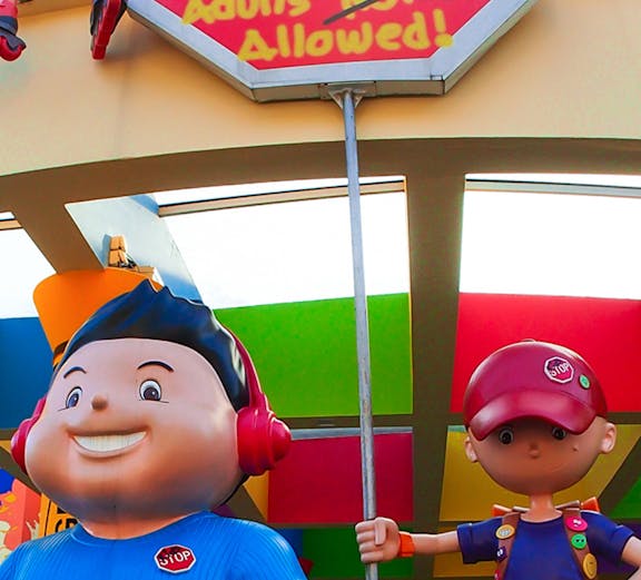 KidsStop Singapore entrance with colorful cartoon figures and playful signage.