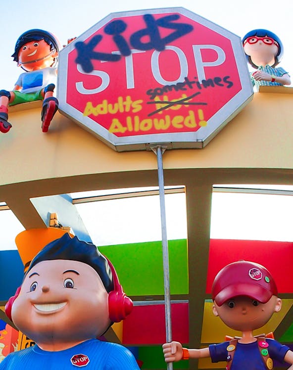 KidsStop Singapore entrance with colorful cartoon figures and playful signage.