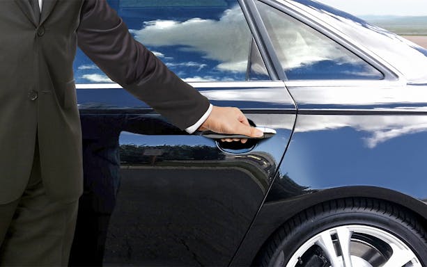 Dubai airport transfer vehicles lined up for shared or private transport options.
